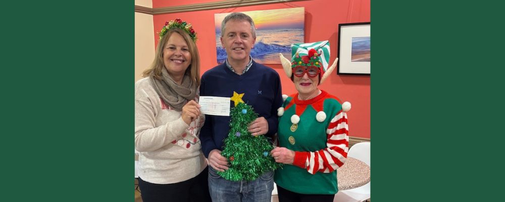 Christ Church Consett receiving Project genesis Trust cheque